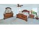 Spacious bedroom with wood furniture, a ceiling fan, and great natural light at 1821 E Patrick Ln, Phoenix, AZ 85024