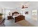 Bright and airy main bedroom with wood furnishings, neutral colors, and large windows offering great natural light at 1821 E Patrick Ln, Phoenix, AZ 85024