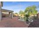 Outdoor pool area featuring a custom pool, rock accents, and a covered patio with decorative concrete at 1821 E Patrick Ln, Phoenix, AZ 85024