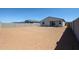 Large backyard of a single-story home with sliding glass doors at 19320 N Diego Way, Maricopa, AZ 85138