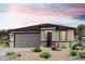 Charming single-story home with a two-car garage and desert landscaping at 19320 N Diego Way, Maricopa, AZ 85138