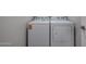 A laundry room features a modern washer and dryer, offering a functional space at 19320 N Diego Way, Maricopa, AZ 85138