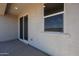 Covered patio with windows, sliding glass doors, and a concrete floor at 19320 N Diego Way, Maricopa, AZ 85138