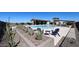 Community pool area with lounge chairs, dining tables, and cactus landscaping at 19320 N Diego Way, Maricopa, AZ 85138