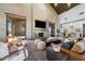 Inviting lounge area with fireplace, comfortable seating, and bright natural light at 20747 E Arroyo Verde Dr, Queen Creek, AZ 85142