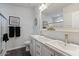 Bright bathroom with dual sinks, framed mirror, and a glass-enclosed shower at 2206 S Ellsworth Rd # 160B, Mesa, AZ 85209