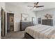 Cozy bedroom with neutral tones, featuring a ceiling fan and natural light at 2206 S Ellsworth Rd # 160B, Mesa, AZ 85209