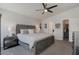 Comfortable bedroom featuring a ceiling fan and an accessible walk-in closet at 2206 S Ellsworth Rd # 160B, Mesa, AZ 85209
