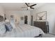 Comfortable bedroom featuring a ceiling fan and rustic-style dresser at 2206 S Ellsworth Rd # 160B, Mesa, AZ 85209