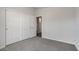 Simple bedroom with sliding closet doors and neutral-colored walls at 2206 S Ellsworth Rd # 160B, Mesa, AZ 85209