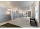 Expansive bonus room features epoxy flooring, recessed lighting, and neutral color palette at 2206 S Ellsworth Rd # 160B, Mesa, AZ 85209