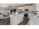 Bright open kitchen with stainless appliances, marble counters, island, and access to living room at 2206 S Ellsworth Rd # 160B, Mesa, AZ 85209