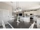 Open-concept kitchen flowing into the dining area, featuring modern appliances and ample counter space at 2206 S Ellsworth Rd # 160B, Mesa, AZ 85209