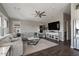 Bright living room featuring a plush sectional sofa, ceiling fan, and contemporary decor for cozy living at 2206 S Ellsworth Rd # 160B, Mesa, AZ 85209