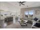 Open-concept living space with a cozy sectional, dining area, and modern kitchen, perfect for entertaining at 2206 S Ellsworth Rd # 160B, Mesa, AZ 85209