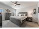 Serene main bedroom features a king-size bed, a ceiling fan, and a dresser at 2206 S Ellsworth Rd # 160B, Mesa, AZ 85209