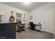 Functional home office space with a desk, chair, keyboard, and acoustic guitar at 2206 S Ellsworth Rd # 160B, Mesa, AZ 85209