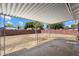 Expansive backyard with covered patio and block fencing, perfect for outdoor living at 2223 E Roma Ave, Phoenix, AZ 85016