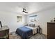 Bright bedroom with hardwood floors, a ceiling fan, and neutral decor at 2223 E Roma Ave, Phoenix, AZ 85016