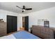 Comfortable bedroom with hardwood floors, ample storage space, and a ceiling fan at 2223 E Roma Ave, Phoenix, AZ 85016