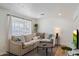 Cozy living area with a large sectional sofa and stylish decor at 2223 E Roma Ave, Phoenix, AZ 85016