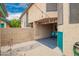 This property boasts a private backyard with covered parking and desert landscaping at 225 W 1St St # 107, Mesa, AZ 85201