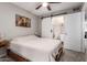 This view of the bedroom shows its neutral tones and convenient access to a Primary bathroom at 225 W 1St St # 107, Mesa, AZ 85201