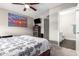 Bedroom featuring neutral tones, carpet flooring, and ensuite bathroom at 225 W 1St St # 107, Mesa, AZ 85201