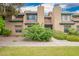 Inviting two-story townhome with desert landscaping and a red tile roof at 225 W 1St St # 107, Mesa, AZ 85201