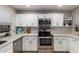 Bright kitchen features stainless steel appliances and white cabinetry at 225 W 1St St # 107, Mesa, AZ 85201