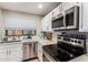 Kitchen showcases stainless steel appliances, and bright countertops at 225 W 1St St # 107, Mesa, AZ 85201
