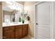 Bathroom view with sink, cherry cabinets, towel rack, and tile floors at 23309 N Las Positas Ct, Sun City West, AZ 85375