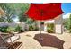 Private courtyard featuring brick pavers, an outdoor seating area, and mature landscaping at 23309 N Las Positas Ct, Sun City West, AZ 85375