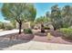 Charming home showcasing mature landscaping, a well-manicured lawn, and a welcoming curb appeal at 23309 N Las Positas Ct, Sun City West, AZ 85375