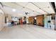 Expansive three car garage with epoxy floor, custom storage cabinets and refrigerator at 23309 N Las Positas Ct, Sun City West, AZ 85375