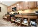 Spacious kitchen with modern cabinets, a black microwave, and pull out storage at 23309 N Las Positas Ct, Sun City West, AZ 85375