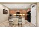 Stylish kitchen with updated appliances, a center island, and modern lighting fixtures at 23309 N Las Positas Ct, Sun City West, AZ 85375