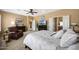 Cozy main bedroom featuring a large bed, neutral walls, and modern furnishings at 23309 N Las Positas Ct, Sun City West, AZ 85375