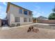 Back exterior view featuring a two-story home with gravel landscaping at 29475 N Candlewood Dr, San Tan Valley, AZ 85143