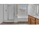 Bathroom featuring a tub and glass enclosed shower at 29475 N Candlewood Dr, San Tan Valley, AZ 85143