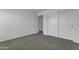 Neutral bedroom with carpet, closet, and white doors at 29475 N Candlewood Dr, San Tan Valley, AZ 85143