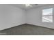 Bedroom featuring a large window, neutral paint, and plush carpets at 29475 N Candlewood Dr, San Tan Valley, AZ 85143