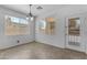 Bright dining area with large windows and a glass paneled door to the backyard at 29475 N Candlewood Dr, San Tan Valley, AZ 85143