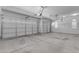 Spacious three-car garage with automatic doors and large open space at 29475 N Candlewood Dr, San Tan Valley, AZ 85143