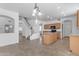 Open-concept kitchen with tile floors, center island, and wooden cabinets creates a warm, inviting space at 29475 N Candlewood Dr, San Tan Valley, AZ 85143