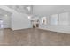 Bright open-concept living space with high ceilings, staircase, and kitchen view at 29475 N Candlewood Dr, San Tan Valley, AZ 85143