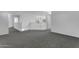 Upstairs landing with white railing, and neutral carpet at 29475 N Candlewood Dr, San Tan Valley, AZ 85143