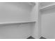 Walk-in closet with built-in shelving and hanging rods at 29475 N Candlewood Dr, San Tan Valley, AZ 85143