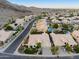 Aerial view captures this desert neighborhood with lush landscaping, mountain views and spacious streets at 3102 E Desert Broom Way, Phoenix, AZ 85048