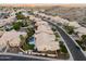 Desert community aerial showcases pools, putting greens, stucco houses and landscaping at 3102 E Desert Broom Way, Phoenix, AZ 85048